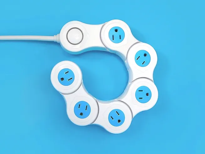 Pivot Power: a white power strip of six rotating outlet segments, curled into a spiral